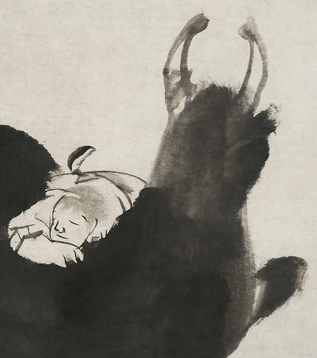Boy sleeping on a Bull