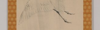 A White Heron Flying in the Rain